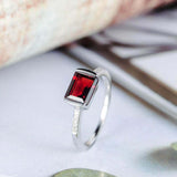 1.5ct Emerald Cut Red Garnet Accents with Solitaire Ring 14k White Gold Finish