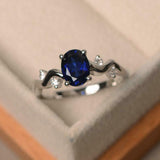 1ct Oval Cut Blue Sapphire Solitaire Round Wavy Accent Ring 14k White Gold Over