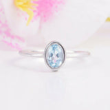 1ct Oval Cut Blue Topaz Engagement Ring Bezel Set Solitaire 14k White Gold Over