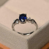 1ct Oval Cut Blue Sapphire Solitaire Round Wavy Accent Ring 14k White Gold Over