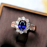 2ct Oval Cut Blue Sapphire Floral Halo Baguette Accent Ring 14k Rose Gold Finish