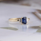 1.5ct Emerald Cut Blue Sapphire Engagement Ring Trilogy 14k Yellow Gold Finish