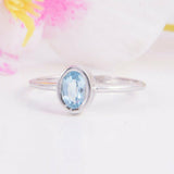 1ct Oval Cut Blue Topaz Engagement Ring Bezel Set Solitaire 14k White Gold Over