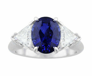 2Ct Oval Cut Blue Sapphire Trillion Accents Three Stone Ring 18k White Gold Over