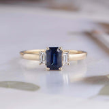 1.5ct Emerald Cut Blue Sapphire Engagement Ring Trilogy 14k Yellow Gold Finish