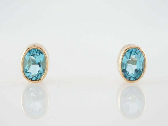 3.2ct Oval Cut Blue Topaz Bezel Set Solitaire Stud Earrings 14k Yellow Gold Over