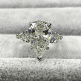 3Ct Pear Cut Diamond Three Stone Solitaire Engagement Ring 18K White Gold Finish