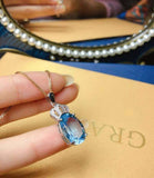 2.1ct Blue Topaz Pendant with Chain Oval Cut Diamond Crown 14k White Gold Finish