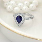 2Ct Pear Cut Blue Sapphire Bezel Set Diamond Halo Ring 14K White Gold Finish