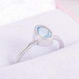 1ct Oval Cut Blue Topaz Engagement Ring Bezel Set Solitaire 14k White Gold Over