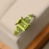 2ct Emerald Cut Green Peridot Pear Accents Trilogy Ring 14k White Gold Finish