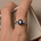 1ct Oval Cut Blue Sapphire Solitaire Round Wavy Accent Ring 14k White Gold Over