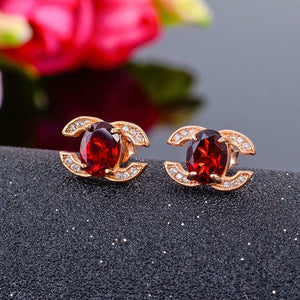 1.5ct Oval Cut Red Garnet Logo Stud Women Earrings 14k Rose Gold Finish